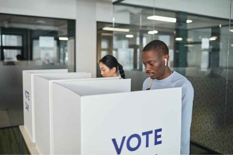 People voting in booths